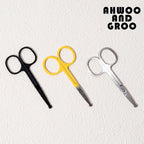 Three pairs of scissors in black, yellow, and silver on a textured white background with 'AHWOO AND GROO' text.